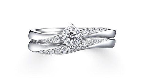 The Alceste bridal set is designed to create a graceful, unified flow when the engagement ring and wedding band are worn together.